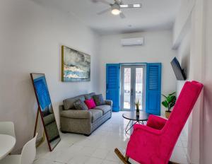 a living room with a couch and a table at Casa Pelayo in San Juan +16 photos