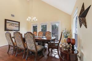 a dining room with a table and chairs at Whispering Ridge Ranch in Wimberley