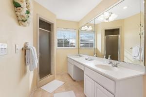 a bathroom with a sink and a mirror at Whispering Ridge Ranch in Wimberley +38 photos