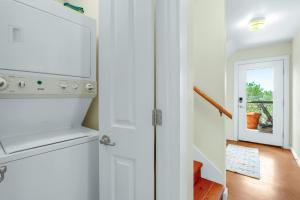 a kitchen with a washer and dryer next to a door at Valley View in Fischer