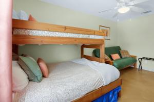 a bedroom with a bunk bed and a couch at Valley View in Fischer