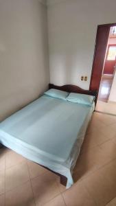 a large bed in a room with at Hotel Real Caracoli in Guamal