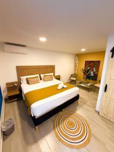 a bedroom with a large bed in a room at Hotel Casa Oliveros in Rivera +31 photos