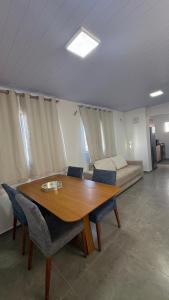 a table and chairs in a room with a bed at Maramarbh43 in Luis Correia +12 photos
