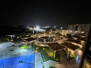 a view of a parking lot at night at Compound Porto New Cairo in Cairo