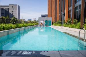 a swimming pool on the side of a building at Hotel Waterloo Singapore - Handwritten Collection in Singapore