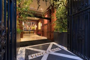 an entrance to a building with a viceroy me sign on the sidewalk at Vincci Mae in Barcelona