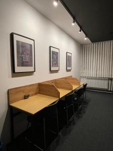 a conference room with a long wooden table and chairs at Kyiv Hostel and Hotel in Kyiv
