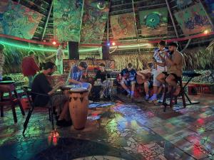 a group of people sitting in a bar at Rocking J's in Puerto Viejo