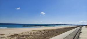 a view of a beach with the ocean at Suzume no oyado SO1 in Shima