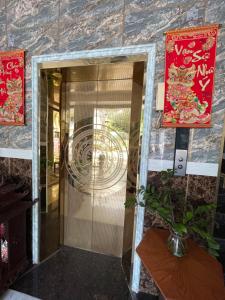 a entrance to a building with a glass door at King hotel in Dĩ An