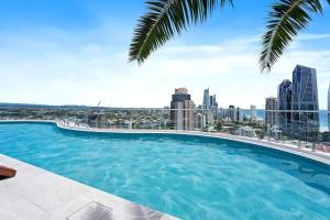 a large swimming pool with a view of the city at The Gallery Broadbeach - Hosted by Gold Coast Luxury Resorts in Gold Coast