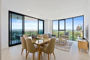 a dining room with a table and chairs at The Gallery Broadbeach - Hosted by Gold Coast Luxury Resorts in Gold Coast +14 photos