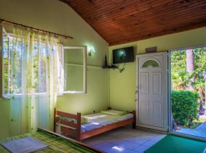a room with a room with a door and a window at Nirvana Apartments & Auto Camp in Kumbor