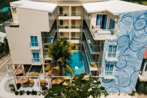 an aerial view of a building with a pool at Cher resort Maldives in Kamadhoo