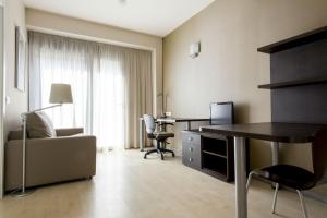 a hotel room with a desk and a chair at Residencia Universitaria Damia Bonet in Valencia