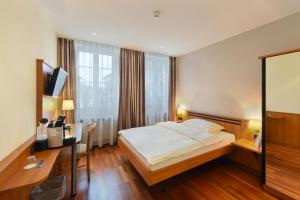 Postel nebo postele na pokoji v ubytování Apart Hotel Amadeo