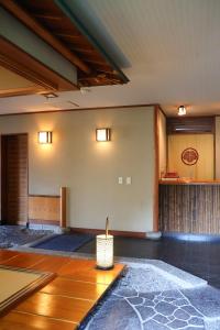 a living room with a room with a table at Renovated room! Japanese inn Matsumoto in Ichinoseki