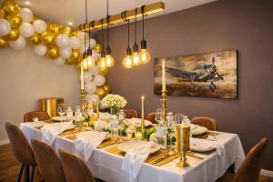 a dining room with a long table with balloons at Luxury Loft Duplex Penthouse Of 190m2 & Free Parking ! in Brussels