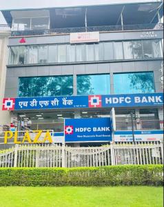 a building with a hride bank sign in front of it at Nirvana Bliss By Cosy Homes, Malsi in Dehradun