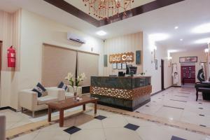 a lobby of a hotel with a waiting room at Hotel One Bahawalpur in Bahawalpur