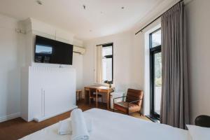 Llit o llits en una habitació de Royal Hotel Orange