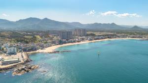 an aerial view of a beach and a city at Goseong Gamnamu Pension in Goseong