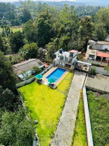 an aerial view of a house with a swimming pool at O2 Resort Welimada in Nugatalawa