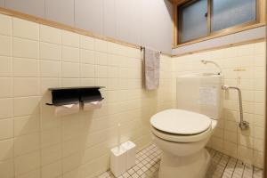 a bathroom with a toilet and a window at CLIP INN by RITO 坂の上の一棟貸し in Tsushima +28 photos