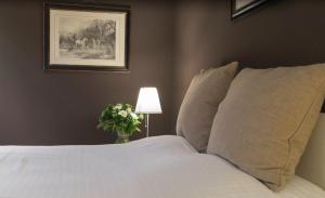 Postel nebo postele na pokoji v ubytování Hotel Hippocampus