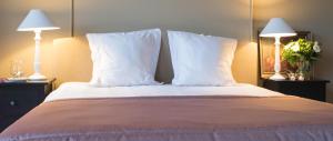 Postel nebo postele na pokoji v ubytování Hotel Hippocampus