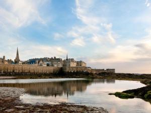 a view of a city with a river and a castle at Ibis Budget Saint Malo Centre in Saint Malo