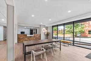 a dining room with a table and chairs at ECHO Suites Extended Stay by Wyndham Sterling in Sterling