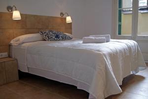 Posteľ alebo postele v izbe v ubytovaní Hostal Martinval