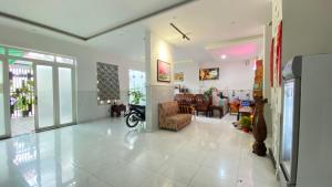 a living room with a couch and a living room at Nhật Minh Hotel in Thuan An