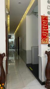 a hallway with two vases on the side of a building at Nhật Minh Hotel in Thuan An