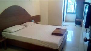 Postel nebo postele na pokoji v ubytování Hotel Rajdeep