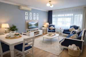 a living room with a couch and a table at Emirhan Guesthouse & Suites in Istanbul