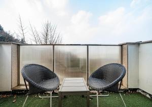 two chairs and a table on a patio at Myeongdong Chungmuro Youngin Hotel in Seoul +27 photos