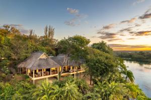 an aerial view of a villa on the banks of a river at Divava Okavango in Bagani