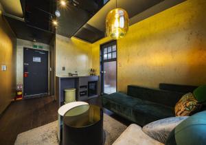 a living room with a couch and a table at Myeongdong Chungmuro Youngin Hotel in Seoul