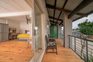 a balcony with a bedroom and a bed at Graskop Hotel in Graskop