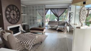 a living room with a zebra patterned wall at villa relax in Riva del Garda