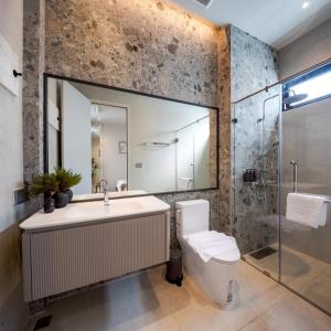 a bathroom with a sink and a toilet and a shower at POV Pool Villas in Ko Larn +29 photos