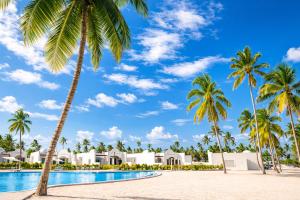 a view of the resort from the beach with palm trees at Diamonds Bijoux in Bwejuu