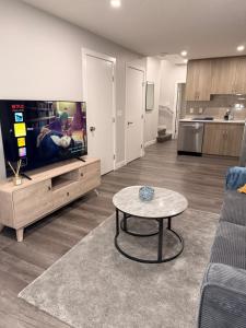 a living room with a couch and a table at Casa Gabriel in YYC