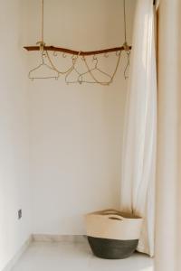 a room with a basket and a curtain at ISOLA - Surf House in Ahangama +60 photos