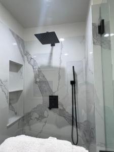 a bedroom with a shower with a stone wall at Lake Shastina Golf Resort in Weed
