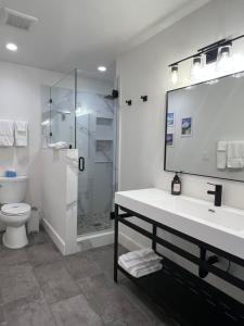 a bathroom with a sink and a shower and a toilet at Lake Shastina Golf Resort in Weed