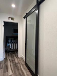 a sliding glass door in a room with a bedroom at Lake Shastina Golf Resort in Weed